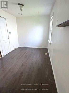 Oshawa (Central) apartment for rent - A room with wooden flooring and white walls.