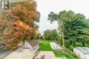 Toronto (Clairlea-Birchmount) apartment for rent - A view of a park with a pathway and trees.