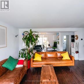 Toronto (Clairlea-Birchmount) apartment for rent - A living room with a brown leather couch and a wooden coffee table.