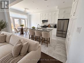 Oakville (Nw Northwest) apartment for rent - A modern kitchen with a dining area and a living room.