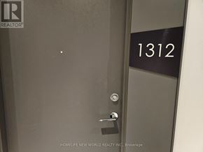 Toronto (York University Heights) condo for rent - A door with a handle and a sign that says 1312.