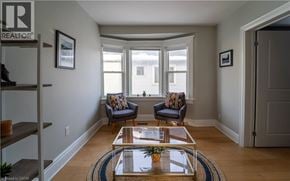 Kitchener apartment for rent - A living room with a glass table and two chairs.