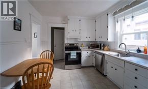 Kitchener apartment for rent - A kitchen with a table and chairs.