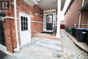 Mississauga (Churchill Meadows) apartment for rent - A brick house with a white door and a small porch.