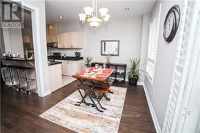 Mississauga (Churchill Meadows) apartment for rent - A dining room with a wooden table and chairs.