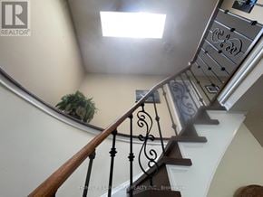 Georgina (Keswick North) apartment for rent - A staircase with a metal railing and wooden steps.