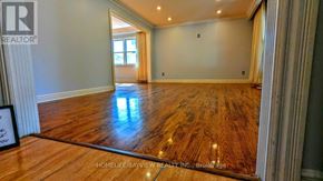 Markham (Royal Orchard) apartment for rent - A spacious room with wooden flooring and a large window.