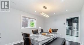 Brampton (Northwood Park) apartment for rent - A dining room with a table set for two and a window showing greenery outside.