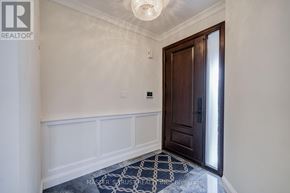 Richmond Hill (Westbrook) apartment for rent - A hallway with a wooden door and a rug on the floor.