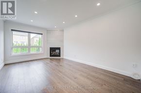 Richmond Hill (Westbrook) apartment for rent - A spacious room with a fireplace and large windows.
