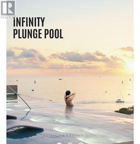 Barrie (City Centre) condo for rent - A person is sitting in an infinity plunge pool with a view of the sea and boats.