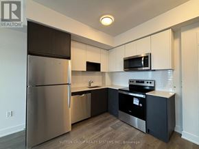 Mississauga (City Centre) condo for rent - A kitchen with a refrigerator, microwave, oven, and sink.