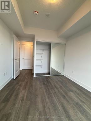 Mississauga (City Centre) condo for rent - A room with wood flooring and white walls.