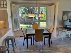 Collingwood townhouse for rent - A dining room with a table set for four.
