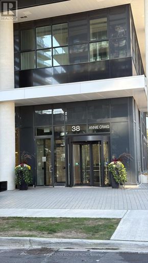 Toronto (Mimico) condo for rent - The front of a building with the name "Anne Craig" on it.