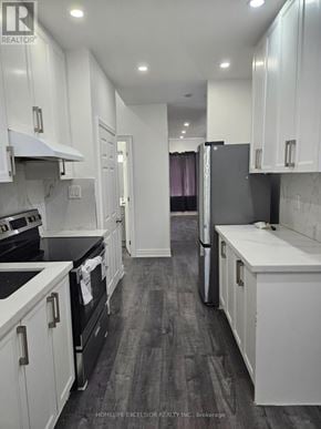 Toronto (Woburn) apartment for rent - A kitchen with white cabinets and black appliances.