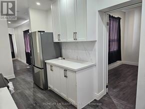 Toronto (Woburn) apartment for rent - A kitchen with white cabinets and a refrigerator.