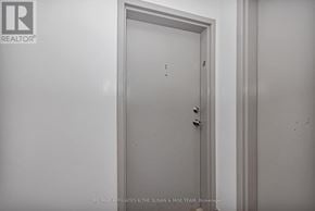 Ottawa townhouse for rent - A white door with a handle and a keyhole.