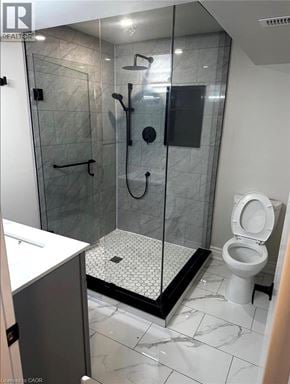 Waterloo apartment for rent - A bathroom with a walk-in shower and a toilet.