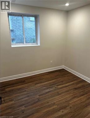 Waterloo apartment for rent - A room with wooden flooring and a window showing a blue sky.