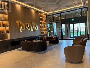 Vaughan (Vaughan Corporate Centre) condo for rent - A reception area with a brown sofa and chairs.