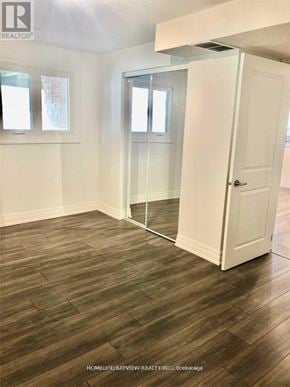 Richmond Hill (Devonsleigh) apartment for rent - A room with a white door and a window.