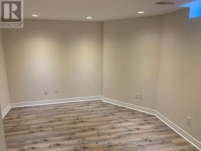 Richmond Hill (Westbrook) apartment for rent - A room with wooden flooring and white walls.