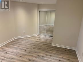 Richmond Hill (Westbrook) apartment for rent - A room with wooden flooring and a sliding glass door.