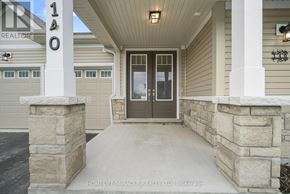 Loyalist (Bath) apartment for rent - The front porch of a house with a stone pillar and a glass door.