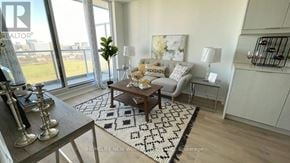 Toronto (Henry Farm) condo for rent - A well-lit living room with a large window, a coffee table, and a rug.