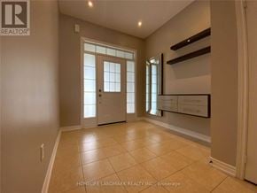 Vaughan (Vellore Village) townhouse for rent - A spacious room with a door and a window.