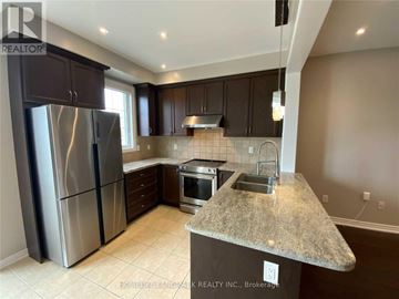 Vaughan (Vellore Village) townhouse for rent - A kitchen with granite countertops and stainless steel appliances.