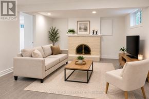 Aurora (Aurora Highlands) apartment for rent - A living room with a couch, a coffee table, and a fireplace.