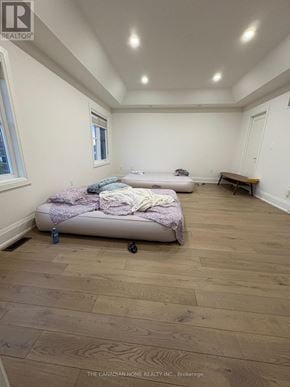 Brampton (Northwest Brampton) apartment for rent - A bedroom with a bed and a bench in it.