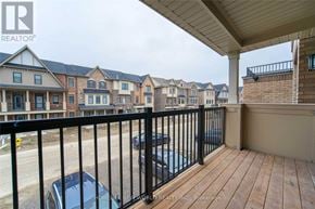 Markham (Victoria Square) townhouse for rent - A balcony with a black railing and a car parked below.