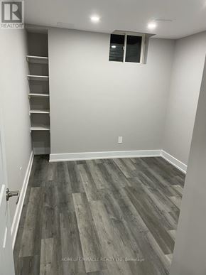 Brampton (Credit Valley) apartment for rent - A room with wooden flooring and a white door.