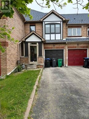 Mississauga (Lisgar) townhouse for rent - A house with a red garage door is numbered 3920.