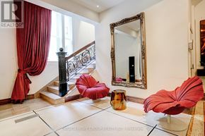 Toronto (Church-Yonge Corridor) condo for rent - A living room with a red chair and a mirror.