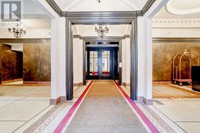 Toronto (Church-Yonge Corridor) condo for rent - A hallway with a red carpet and a blue door.