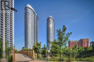 Toronto (Agincourt South-Malvern West) condo for rent - A cityscape with three tall buildings and a bridge in the foreground.