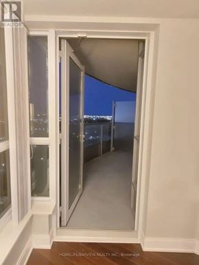 Toronto (Agincourt South-Malvern West) condo for rent - A real estate company is advertising a property with a view of the city at night.