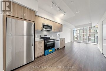 Toronto (Humber Heights) condo for rent - A modern kitchen with wooden cabinets and stainless steel appliances.
