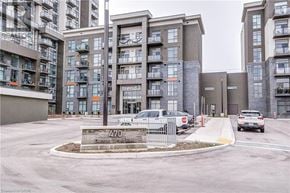 Waterdown condo for rent - Apartment complex with cars parked in front and a sign that says 470 Dundas Street East.