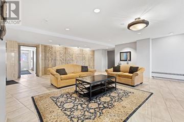 St. Catharines (Glendale/Glenridge) condo for rent - A living room with two couches and a coffee table.