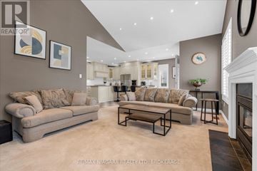 Niagara-On-The-Lake (Glendale) apartment for rent - A living room with a beige couch and a coffee table.