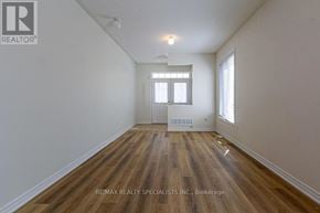 Milton (Sc Scott) apartment for rent - A room with wooden flooring and white walls.