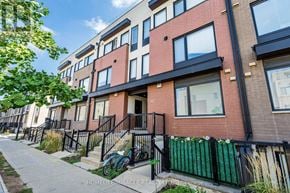 Toronto (Downsview-Roding-Cfb) townhouse for rent - A row of townhouses with a sidewalk in front.