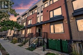 Toronto (Downsview-Roding-Cfb) townhouse for rent - A row of townhouses with a sidewalk in front.