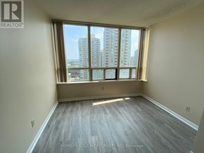 Toronto (Newtonbrook East) condo for rent - A room with a large window overlooking a cityscape.