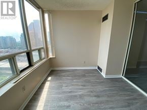 Toronto (Newtonbrook East) condo for rent - A room with a view of the city through large windows.